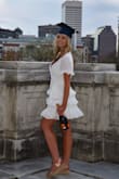 This dress is so flattering with the ruffles. It's so classy and cute. Can't say enough good things! - Melena J.
