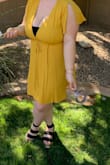 This dress was amazing - so cute and simple! I'm actually a 34J cup so I was worried about fitting up top. The cleavage definitely does not provide coverage, but I just threw a bandeau under it and all was good - my main concern was just not squeezing and flattening the girls which was no issue (lots of wiggle room here!). The dress was super lightweight and comfortable - it was 98 degrees and have a loaded chest, but I was not hot or uncomfortable for a minute in this dress! I would absolutely recommend, but everyone be warned that the chest does not secure without extra measures (security snaps or fashion tape). - Brooke J.