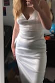 The quality of the fabric is very good and it is true to size! I'm very tall so it was not surprising that it was a little short in the seams in the back. But I think an ironing will help. The broderie back is gorgeous and it hugs the curves perfectly. - Aviaja H.