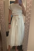 This dress is very cute but it's huge! I wear a medium in most things... The skirt part is heavy and literally falls down even when tied tight. I love it though so I'm going to exchange for a smaller size and hope for the best! - Grayson G.