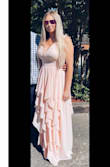 I bought this dress to wear to a wedding, and while I worry about dresses being long enough for me, I could wear heels and still have length. I love this dress so incredibly much and felt like a princess the entire night. HIGHLY recommend this dress! - Carolyn J.