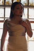I ordered this jumpsuit for my senior prom and I absolutely loved it! The material is thick and feels/looks expensive. There's adjustable straps and the neckline sits comfortably on me. The suit was a bit too long, but I just wore 3-inch heels instead of hemming it. It looks great in pictures and everyone at my prom said it looked expensive. I danced all night and it was so comfortable. Thank you so much Lulus! - Andrea P.