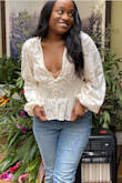 This blouse is beyond gorgeous! It was a bit low cut even for someone small chested like me who can typically wear a plunging neck line easily. It's also a bit sheer so I recommend pairing it with a nude bra or pasties underneath for a little extra coverage. The sleeves were absolutely gorgeous, dramatic, and overall I felt beautiful in the blouse. I even got several compliments when I wore it to brunch! Totally recommend! - Paige T.