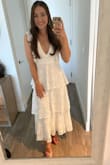 I wore this dress for my bridal shower and got a ton of compliments! I felt so beautiful and confident in it! It runs very very large, I got a small and had to have it brought in a few inches. - Rosie F.