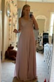 I bought this dress last minute for prom, and it fit perfectly! It was a little long for my height, but not too long that I couldn't wear it. Definitely recommend, it's really pretty. - Lola M.