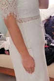 This dress is gorgeous and I had planned on wearing it to my bridal shower. I normally fit into a size medium from Lulus, the medium fit in the top but was super tight around the tummy. I sized up to a large which was a little loose in the top but still a little tight around the midsection. I ordered this in white of course, the least forgiving color. I didn't love the way my tummy pooch looked in this dress and ended up wearing a white Lulus wrap dress instead. Will be returning. - Jennifer B.