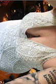 I am in love with this dress. I had been eying it and waiting for a smaller size to come in but went with the XL because I just couldn't wait. I had even bought another dress from here and returned it. I knew in my heart this was the one. It is absolutely gorgeous and works perfectly for my boho themed wedding. The color is not white. I will be getting this dress altered to fit, to open up the back and to remove some of the sheer material on the bust. This dress is a showstopper will not disappoint. Dress is as described. - Alesha W.