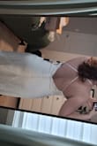 I started having doubts about my original wedding dress so I ordered this and a few others from Lulus. The material is beautiful - it has a nice weight and flow to it. I was worried that satin would show every bump and imperfection, but the dress is very flattering! I ADORE the back. If I keep it, I will probably need to have it altered, as the straps are a little short and it sits funny around my bust. I would also have the hips taken in slightly. Overall, great dress! - Shaelyn W.