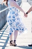 Wore for beach engagement photos. I didn't want an only white dress so the blue flowers were a perfect touch. Photographed nicely and flowed well in the wind. - Rachel W.