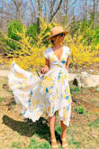 This dress is STUNNING! I definitely suggest sizing down. I'm normally a small but went with an extra small after reading the reviews and I'm very glad I did. 
It has wonderful movement and the quality is worth every penny! - Lauren O.