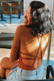 The fit is a little bit loose but the color and back is beautiful!!! - Melany S.