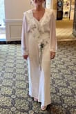 Very pretty on. I wore 3.5in heels and length was perfect. Only downfall is the fabric on the top is very delicate and snags easy. - Ashley K.