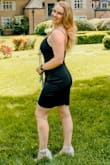 The material is stretchy and feels really nice. My only two complaints are lack of zipper (it's difficult to pull up over your butt or down over your shoulders) and it is NOT conducive to walking around in. Definitely rides up with each step. - CheyAnn S.