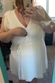 To be fair, the overall size of this dress seemed to fit well. I typically wear a 3x/22 and it fit well around every part of my body- except my chest. In the pic attached I had to hold the pieces together so my chest was not popping out. It is 100% unwearable for someone with a large chest like myself. I couldn't even pin it to keep it closed, which is unfortunate given it's a super cute dress! I definitely would recommend it if you have a smaller chest as it looks super cute on. Another downside, it was super hard to figure out how to put it on at first. I spent a good five minutes trying to figure out how to wrap it/wear it and I'm not even sure if I got it 100% right. It is a wrap dress so it completely unwraps like a towel and you have to figure out which strings go through which holes. - Ashley D.