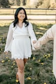 I loved the lace details of this romper, and it's even more beautiful in person! It photographs well, and is the perfect bridal white. The cinched waist gives you shape and very stretchy and comfortable to wear. I love the bell sleeves and the sheer ness makes the romper look so airy and lightweight. Wore this for my engagement shoot photos and so happy I did! Highly recommend! - Nicole E.