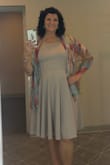 My adult daughter has always been my fashion consultant and she picked this dress for me to wear to my nephew's wedding.  It was perfect from the first try-on!  The knit material feels nice and drapes well. The large was true to size and the waist was very comfortable and flattering.  I was a little uncomfortable with the strappy top so I wore a thin scarf, (except when dancing!)  The gray has just the subtlest hint of lavender.  My daughter was right again -this dress was just right for the wedding!  I will add a light sweater and wear the dress to church or date night. 10 out of 10 for this flirty find! - NormaJean L.