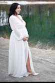 Loved this dress for my elopement! I ordered a medium in hopes that it would fit my little boobies, but also accommodate my 8 month pregnant belly. It fit almost perfectly! I did end up having to take the breast part in just a bit, but the sleeves were a perfect length, and the overall fit was amazing. Also super loved the material! I got married in the mountains in Canada and it was quite cold, but the dress kept me surprisingly warm (at least warmer than if I had worn a strapless dress). Great quality fabric. Love love love this dress. - Danika H.
