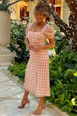 I am 66 years old and I am always looking for clothing that is age appropriate, not frumpy, but still has that, "I am loving life look" and this had it all.  I felt very comfortable with the slit, not to high.  Definitely a Reformation look, without the price. Priceless. - Connie K.