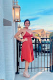 The dress is very lightweight making it perfect for the outdoor wedding in which it was purchased. As was mentioned in other reviews, the fabric does wrinkle easily. Overall beautiful dress with great movement and accentuation of curves. - Karrie H.
