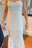 I like the material, it doesn't look cheap but as it is lace, it's easy to pull strings... it looks pretty and will be perfect for my elopement, I just need to get it hemmed a bit. - Rossana C.