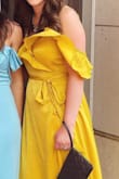 I truly love the style and color of this dress! It is a little low in cleavage area for my liking, but used a pin and it was perfect! I received so many compliments while at a wedding! It flows beautifully too!! Buy it...you will love it too!! It was a windy day in the pic :) - Adahlia D.