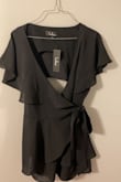 I loved this when I first got it! It was exactly like the photo, until I put it on. I have a romper similar that's long enough, but this one was a def no. It was so short through the torso my butt cheeks were hanging out. I WOULD NOT RECOMMEND FOR TALL GIRLS! I'd say 5'9 and over is a no unless you want the cheeks out. It's cute though, and I sold it to my best friend who's 5'3 and she looks great in it. - Taylor W.