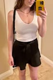 This top is perfection. It is not so cropped that you see a ton of skin if you move or raise your arms, it's form fitting but comfortable, not restrictive, and the straps are very flattering. The fabric is thick enough to not be see through but not so thick it's too stuffy. The v cut is just enough to show chest but not too revealing unless you want to wear a push-up with it. Seriously wish this came in more colors. - Tonya H.