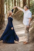 I bought this dress in the blue for engagement photos, I originally ordered a M, however the front did not have enough coverage when wrapped so I went to a large. The dress is definitely long and had I wore it to an event it would have needed to be hemmed. I wore this with a Wedge sandal for engagement photos and received a lot of compliments. Super comfortable, flattering, and fun. - Danielle A.