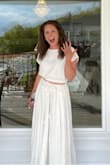 I wore this for my bachelorette party at a winery and got so many compliments! The skirt is well lined and heavy, not at all sheer. It did feel like it was falling down and I had to keep tying it, but I still 100% recommend! - Dana W.
