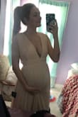 I was 26 weeks pregnant when I wore this for our backyard wedding, and it was PERFECT. I'm normally a medium but ordered a large because I'm tall and to fit the bump, but had to take it in and should have ordered a medium. I'm normally always nervous about length because I'm 6ft, but the length was perfect. There was so much room for the bump! I could probably wear it up to term. If you're expecting, order your pre pregnant size!! I have only good things to say about this dress! - Jessica S.