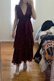 This dress is gorgeous and fits beautifully; I'm usually between a small and medium and the small fit perfectly. Because I ordered the smaller size and don't have a particularly large chest, the deep v was not too much for me. Excited to wear! - Brianna S.