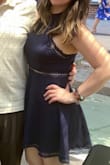 The dress fits great! The neck was a little uncomfortable at times. Wore a sticky bra but super comfy and flattering! - Sioban P.