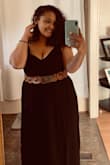 At first I was very hesitant on getting a medium in this dress because I usually wear a large. I was looking through other reviews and seen that the dress ran a little larger than expected, so I decided to get a medium and it fits perfect! It's so hard to find a dress that fits good and looks good. The straps weren't bad at all and hardly fall down since I sized down. I could have worn a large and been comfortable as well, but I hate sending things back. I'm very happy with my purchase. I recommend. - Holly M.
