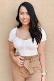 I was a little skeptical about this shirt at first, but after I tried it on I instantly fell in love! If you have a bigger bust I would recommend sizing up. - Marisol P.