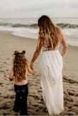 I was hunting for the perfect dress for family photos on the beach & I ended up ordering this one. I AM SO GLAD I DID!!!! Literally fit perfectly. Even with a very small bust; I'm normally afraid to wear anything without a bra, but this dress is beautiful and the material isn't see-through at all! The material is the perfect thickness. I'm going to order the same dress in another color for a friends wedding! - Danielle H.