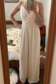 It's beautiful, but it is for larger chested women. On a good day I am 34B and I tightened the top as much as I could, but there was so much extra material up top that it just couldn't be fitted enough. When I lean over, my boobs totally show. The lengthy is also very, very, long. I am about 5'3. With 3-4in heels, it still drags on the floor. The photo I have attached to my review shows me in the outfit with 3-4in heels. Also, it's not really cream. The stock photo shows it being more white, but in person it is more peach/pink. - Moe C.