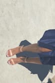 I've ordered heels from Lulus before and I knew I wouldn't be disappointed! My normal shoe size is a 7.5 but I decided to go down to a 7 (7.5 was out of stock). I wore these for my graduation photo shoot and I love how they looked! Nude heels always compliments a white dress! After standing in them for 1.5hr, I do have to say that my pinky toes were a little sore. My feet were REALLY sweaty so my toes were literally hanging off the front. I have long big toes, so going with a 7.5 may have been better (for comfort and for looks). When wearing them again for my actually graduation day, I sprayed hairspray at the bottom of my feet and it helped to stop my foot from sliding! My toes didn't hurt the second time around so breaking them in played a big factor! One other thing to note is that they have a hint of pink in them - it's not your typical brown nude. If you're not trying to get anything too  specific in color, then I suggest you pick these!! Love them! - Cierra R.