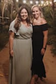 This dress was great! I got a lot of compliments on it and I felt good in it! I'm pretty short, so it was longer than it is on the model, the bottom hit right at my ankle when wearing heels. Definitely is dark navy but in the sun you can tell its not black. - Mariah M.