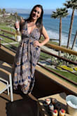 I got this dress to wear to my 30th birthday dinner by the beach! Very good fit, not tight at all which fits with a beachy feel. However....I have some pretty big boobs and my boob tape did not come in time unfortunately when I needed to wear this dress. If you have anything above a C, you will need some type of boob tape. I had to wear this dress bra/boob tape-less, and my boobs stayed in, HOWEVER this is not a supportive halter type dress so I did have some side boob. I read other reviews prior to purchasing this dress and some women stated that they were nervous about their boobs falling out of the dress; I did not have this issue even without my boob tape. I ordered a Medium because that's typically what I wear; the Large would have probably fit my boobs better to be honest, however the dress would have been much too loose. Overall, cute dress! Very comfortable, but for ladies with larger boobs, I would really make sure to get a good boob tape! - Chelsea A.
