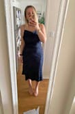 I have a few dresses in this style and I love the fit of this one. It tapers at the waist without being too tight. I went with other reviewers and tried the smaller of my two sizes, happy I did! This is the S and I believe the M would have been too wide. - Samantha R.