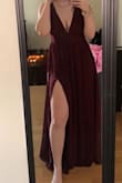 I was so sad to have to return this dress. It for perfectly and made me feel so beautiful! Unfortunately the color was a deeper burgundy than anticipated and I didn't match the other bridesmaids. I am planning on ordering this dress again for another occasion! The way the dress flows is beautiful. The leg slit isn't too pronounced to where you'd be afraid of showing too much, but allows for the perfect amount of leg. Love the deep plunge neckline. A must buy! - Katie H.