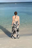 I absolutely love the back of this dress! It's a great dress for a bunch of different occasions. It's also comfortable and the material is light enough that you can easily wear it during summer. One thing to note is that is comes super long and you might need to hem it to ensure you don't trip. - Amy B.