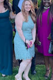 The dress fit perfectly! I wore this for my friend's wedding and it was easy/comfortable to move in when it was party time. Its awkward to wear a normal bra with, and I am no good at taping my chest, it did work well with a strapless for those that have difficulty in using boob tape. The material is great, and I am really pleased with it. Love it! - Maryann A.