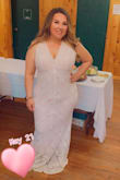 This dress was exactly what I was looking for simple and elegant. If your curvy this dress will compliment you very well. I loved everything about it. I did get the shoulders hemmed a little so my cleavage didn't show as much. Everyone loved my dress. - Samantha R.