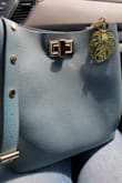 Lovely bag! Gorgeous color and style! Not as sturdy but it's not a big deal. Thanks again Lulus! - Victoria K.
