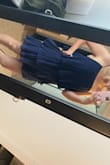 This dress is so pretty but it runs large! I got a Medium and it was falling off my bust and waist! I will have to safety pin it or have it taken in! Posting a pic with it clipped in the back to hold it tighter! - Ali L.