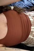 I should've ordered a size up but there is enough stretch where the small still fits. I expected it to be longer, but it's long enough to hide under high waisted shorts, so that's what I'll pair it with. Love the color. - Mary V.
