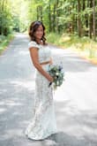 Fits like a glove and extremely flattering. I was skeptical of the two piece but it was my favorite out of all the wedding dresses I purchased to try on. Im so glad I took the chance! It was perfect for our small nuptials. I changed into another Lulus dress for the backyard reception. - Kimberly A.