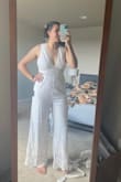 I'm always wary of jumpsuits because I have a semi short torso, but this one fit so well! I tend to be about a size 8 in dresses and pants, and the medium fits like a glove. I cant wait to wear it for my rehearsal dinner :) - Felicia S.
