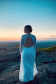 This dress was PERFECT for my mountaintop elopement. I have a very small chest and narrow shoulders, so I had the top altered so the sleeves and bust were tighter. Had to shorten as well, but that was to be expected because I am short :) The dress is SUCH beautiful quality, especially for the price. The lace is beautiful and the deep v front is really flattering. Waist doesn't have any stretch, so order your true size. Small was perfect for me. - Kate E.